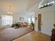 Inviting living room with chandelier, carpet and large windows that provide ample lighting at 1614 Stanbury Dr, Orlando, FL 32818