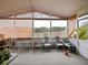 Enclosed sunroom with chairs and views of the outdoor scenery at 1614 Stanbury Dr, Orlando, FL 32818