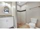 Bright bathroom featuring a granite-topped vanity and tiled walk-in shower at 17008 Sw 32Nd Ter, Ocala, FL 34473