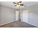 Bedroom with carpet, closet and an open doorway at 17008 Sw 32Nd Ter, Ocala, FL 34473