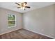 Bedroom with a ceiling fan and a large window at 17008 Sw 32Nd Ter, Ocala, FL 34473