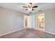 Bedroom with ceiling fan and access to the walk-in closet and en-suite bathroom at 17008 Sw 32Nd Ter, Ocala, FL 34473