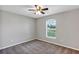 Bedroom with carpet, one window and a neutral colored walls at 17008 Sw 32Nd Ter, Ocala, FL 34473