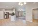 Modern kitchen featuring stainless steel appliances, white cabinets and an eat-in bar with granite countertops at 17008 Sw 32Nd Ter, Ocala, FL 34473