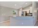 Open kitchen with stainless steel appliances, granite countertops, and stylish tile flooring at 17008 Sw 32Nd Ter, Ocala, FL 34473