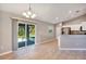 Bright, open kitchen and dining area with tile flooring, stainless appliances, and sliding door access to the outdoors at 17008 Sw 32Nd Ter, Ocala, FL 34473