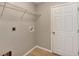 A functional laundry room provides convenience with a wire shelf and easy access, simplifying household chores at 17008 Sw 32Nd Ter, Ocala, FL 34473