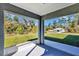 The screened lanai provides a relaxing outdoor space with views of the surrounding landscape and clear blue skies at 17008 Sw 32Nd Ter, Ocala, FL 34473