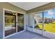 The screened lanai offers views of the lush backyard and includes sliding glass doors for easy indoor-outdoor living at 17008 Sw 32Nd Ter, Ocala, FL 34473