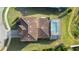 Top-down view of the house, showcasing roofline and pool at 175 Claffey Ct, Haines City, FL 33844