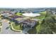 Community view showcasing a house with a pond and other homes at 175 Claffey Ct, Haines City, FL 33844