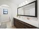 Elegant bathroom with double vanity and large mirror at 175 Claffey Ct, Haines City, FL 33844