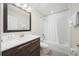Clean bathroom with tub, shower, and wood vanity at 175 Claffey Ct, Haines City, FL 33844