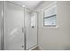 Clean bathroom with a shower and window for ventilation at 175 Claffey Ct, Haines City, FL 33844