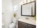 Clean bathroom with vanity, toilet, and decorative plants at 175 Claffey Ct, Haines City, FL 33844