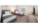 Bedroom with two twin beds, window, and modern nightstands at 175 Claffey Ct, Haines City, FL 33844