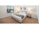 Spacious bedroom with gray upholstered bed and neutral decor at 175 Claffey Ct, Haines City, FL 33844