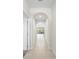 Bright hallway with arched doorways and tile floors at 175 Claffey Ct, Haines City, FL 33844