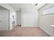 Upstairs hallway with carpet and doors leading to bedrooms and closets at 175 Claffey Ct, Haines City, FL 33844
