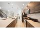 Modern kitchen with wood cabinets, stainless steel appliances and white countertops at 175 Claffey Ct, Haines City, FL 33844