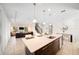 Island kitchen with white quartz countertops and stainless steel appliances at 175 Claffey Ct, Haines City, FL 33844