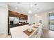 Modern kitchen with stainless steel appliances and a large island at 175 Claffey Ct, Haines City, FL 33844