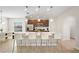 Modern kitchen with island, stainless steel appliances, and white quartz countertops at 175 Claffey Ct, Haines City, FL 33844