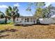 Large backyard with shed and mature trees at 204 Louis St, Leesburg, FL 34748