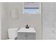 Updated bathroom with new vanity, toilet, and marble shower at 204 Louis St, Leesburg, FL 34748
