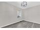 Bright bedroom with gray flooring and a window at 204 Louis St, Leesburg, FL 34748