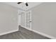 Spacious bedroom with ceiling fan and grey flooring at 204 Louis St, Leesburg, FL 34748