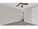 Bedroom with ceiling fan and door to another room at 204 Louis St, Leesburg, FL 34748