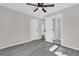 Bright bedroom with two closets and ceiling fan at 204 Louis St, Leesburg, FL 34748