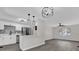 Modern kitchen with white cabinets and stainless steel appliances at 204 Louis St, Leesburg, FL 34748