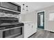 Eat-in kitchen with stainless steel appliances and island at 204 Louis St, Leesburg, FL 34748