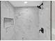 Modern shower with marble tile and niche at 204 Louis St, Leesburg, FL 34748