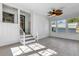 Sunroom features view of backyard and ceiling fan at 204 Louis St, Leesburg, FL 34748
