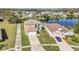 Scenic aerial view of the property and neighborhood, backing onto a serene lake at 2120 Marisol Loop, Kissimmee, FL 34743