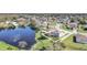 Aerial shot highlights this homes premium lakeside lot, enhanced by mature trees and serene water views at 2120 Marisol Loop, Kissimmee, FL 34743