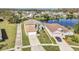 A high angle view of a well kept property, close to a pond in a neighborhood at 2120 Marisol Loop, Kissimmee, FL 34743