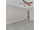 Spacious bedroom featuring tile floors, a ceiling fan, and neutral paint colors at 2120 Marisol Loop, Kissimmee, FL 34743