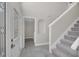 Entry foyer with a staircase to the upper level and access to the washroom at 2120 Marisol Loop, Kissimmee, FL 34743