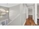 Bright foyer features hardwood floors, a staircase and lots of natural light at 2120 Marisol Loop, Kissimmee, FL 34743