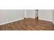 Spacious living room features hardwood floors, neutral walls, and base molding at 2120 Marisol Loop, Kissimmee, FL 34743