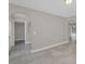 Neutral living room with multiple entryways and tile floors at 2120 Marisol Loop, Kissimmee, FL 34743
