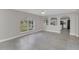 Bright living room with arched windows, tile floors and an open floorplan at 2120 Marisol Loop, Kissimmee, FL 34743