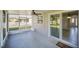 Inviting screened patio with ceiling fan provides access to the home's interior at 2120 Marisol Loop, Kissimmee, FL 34743