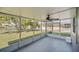 Relaxing screened patio offers beautiful views of the backyard and pond at 2120 Marisol Loop, Kissimmee, FL 34743