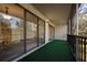 The balcony is spacious, has a view, and is carpeted with artificial turf at 230 Moree Loop # 4, Winter Springs, FL 32708