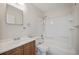 Clean bathroom featuring a shower-tub combo, a wood vanity, and a mirrored cabinet at 230 Moree Loop # 4, Winter Springs, FL 32708
